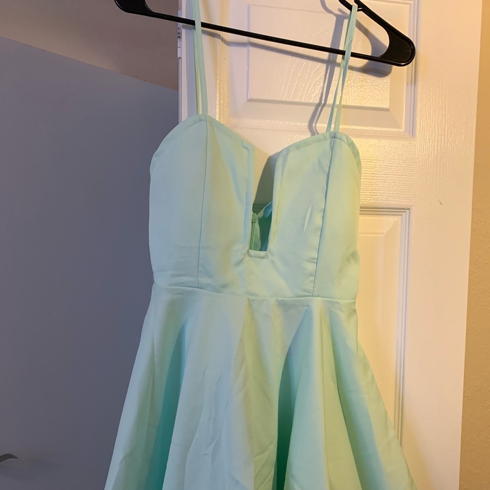 Short mint color dress.